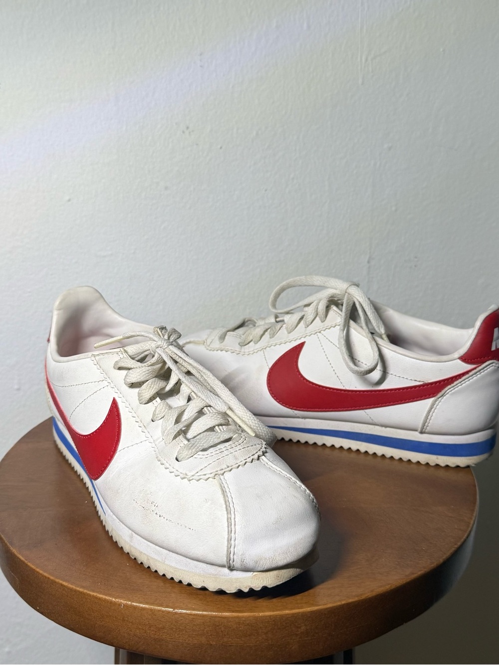 Nike White Leather Sneakers with Red Swoosh and Blue Midsole Stripe